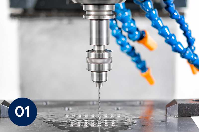Close-up of CNC machine Array Aspheric Machining drill bit working on metal.