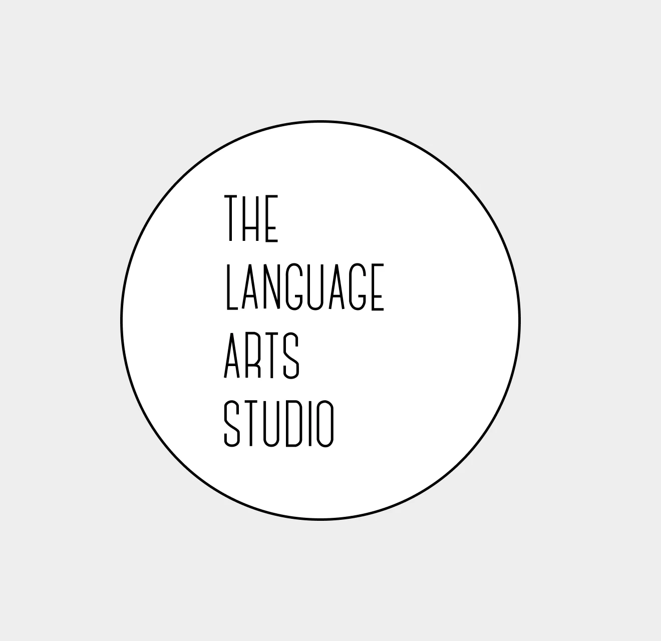 Circular white logo with black border containing the text 'THE LANGUAGE ARTS STUDIO' in vertical alignment.