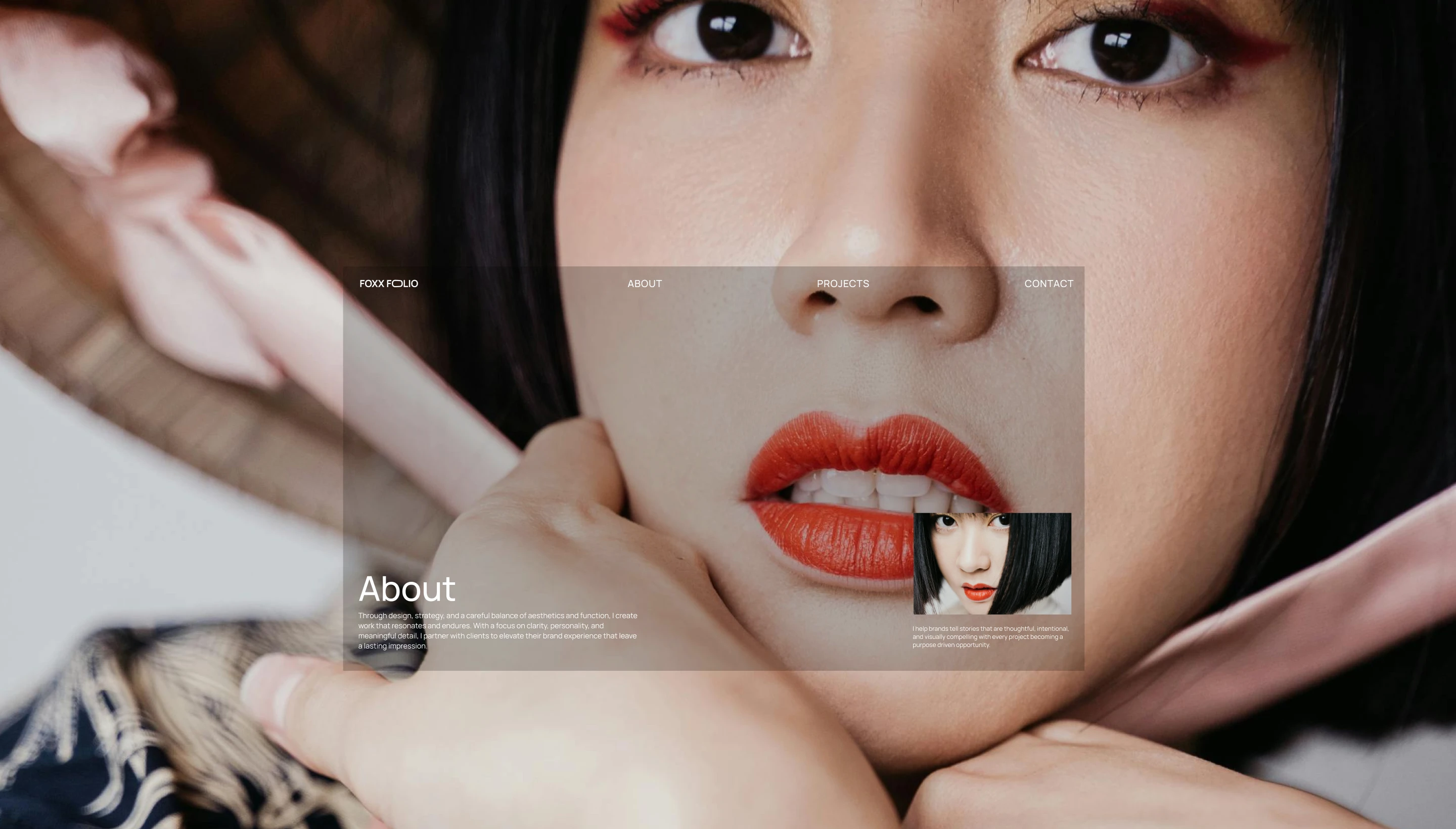Close-up of a woman with black hair, red lipstick, and red eyeshadow wearing a hat with pink ribbon tied under chin.