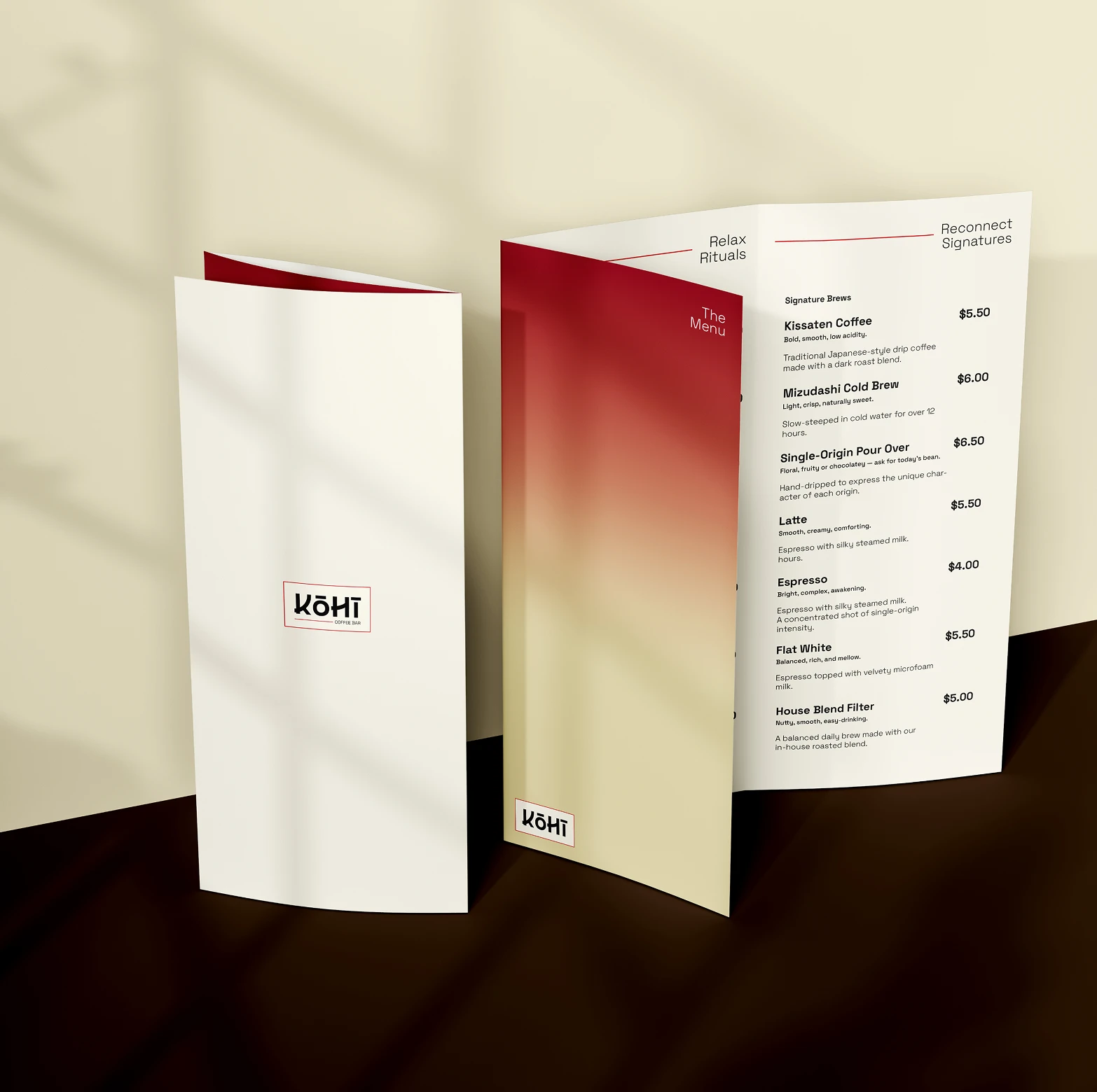 Trifold coffee shop menu for Kohi Coffee Bar with a gradient red to beige cover and beverage listings.