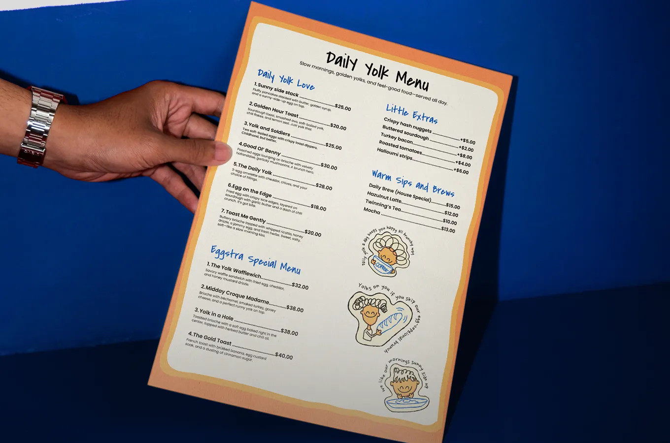 Hand holding a colorful Daily Yolk Menu featuring breakfast items, extras, drinks, and playful egg-themed illustrations on a blue background.