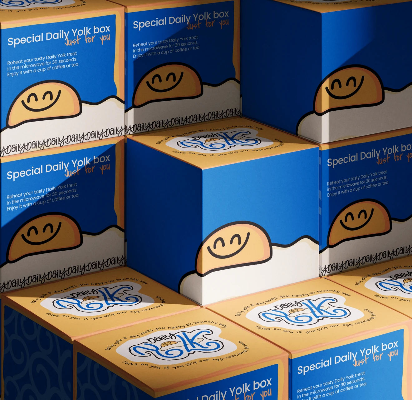 Stacked boxes of Special Daily Yolk featuring a smiling egg yolk illustration and reheating instructions.