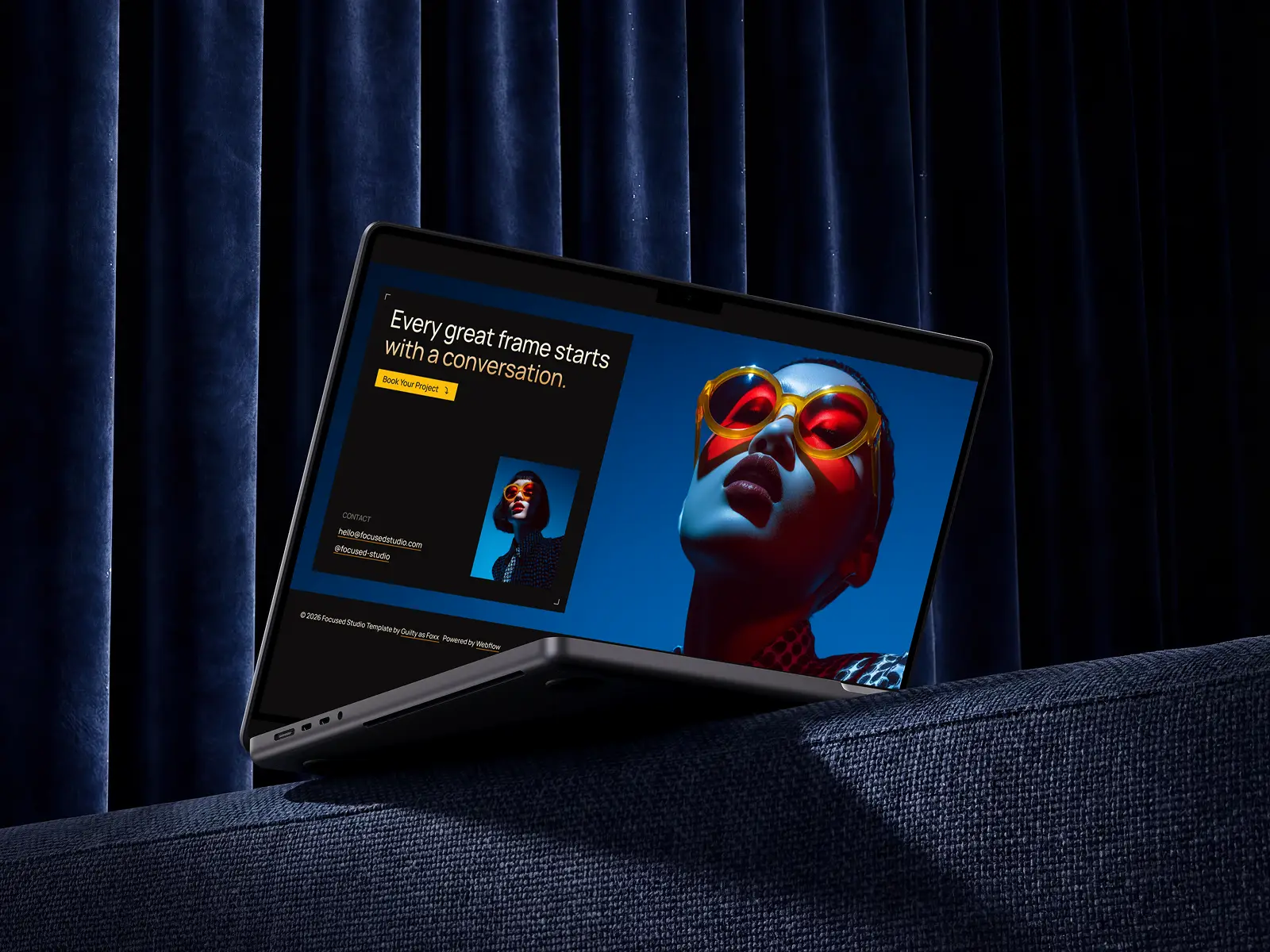 Laptop screen showing a woman with orange glasses and text about starting projects with conversation from the Focused Webflow Template created by Guilty as Foxx