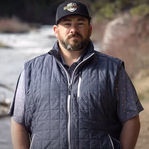 Matt Bassitt standing in front of a river.