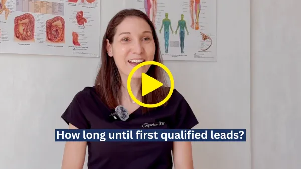 Smiling woman in black shirt speaking in front of anatomy posters with caption 'How long until first qualified leads?'
