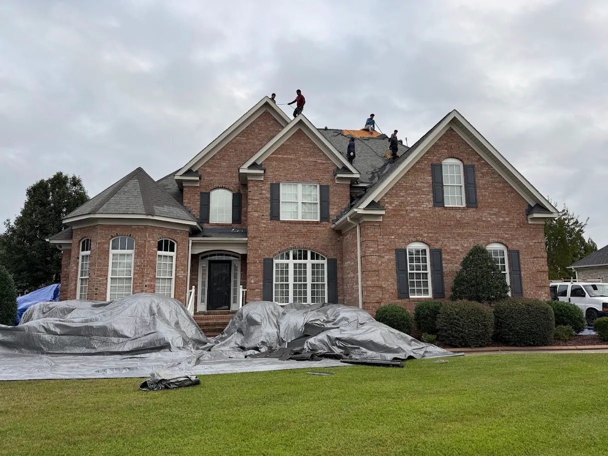 The front exterior of a multi-story brick house in Greenville, North Carolina