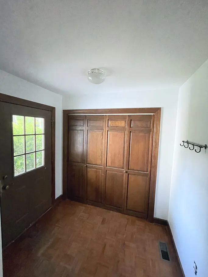 A hallway that has had drywall repair done by Unleashed Renovations