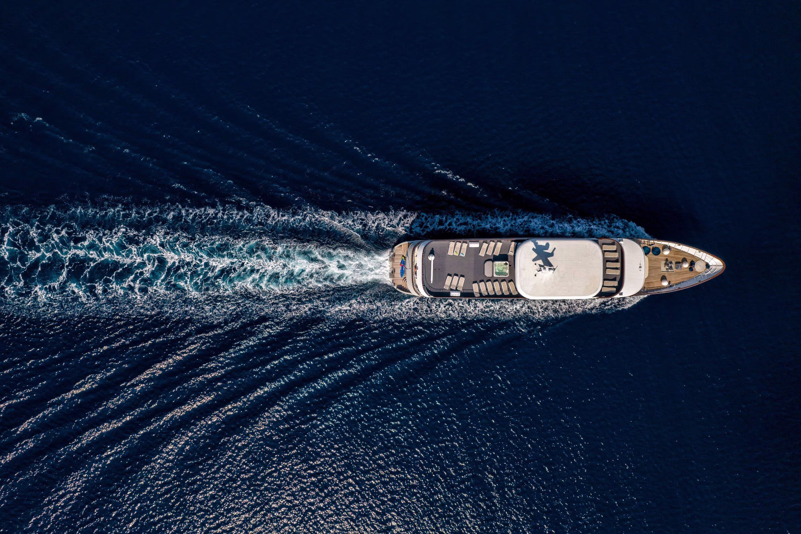 Bird's-eye view of the cruise ship crossing deep blue sea