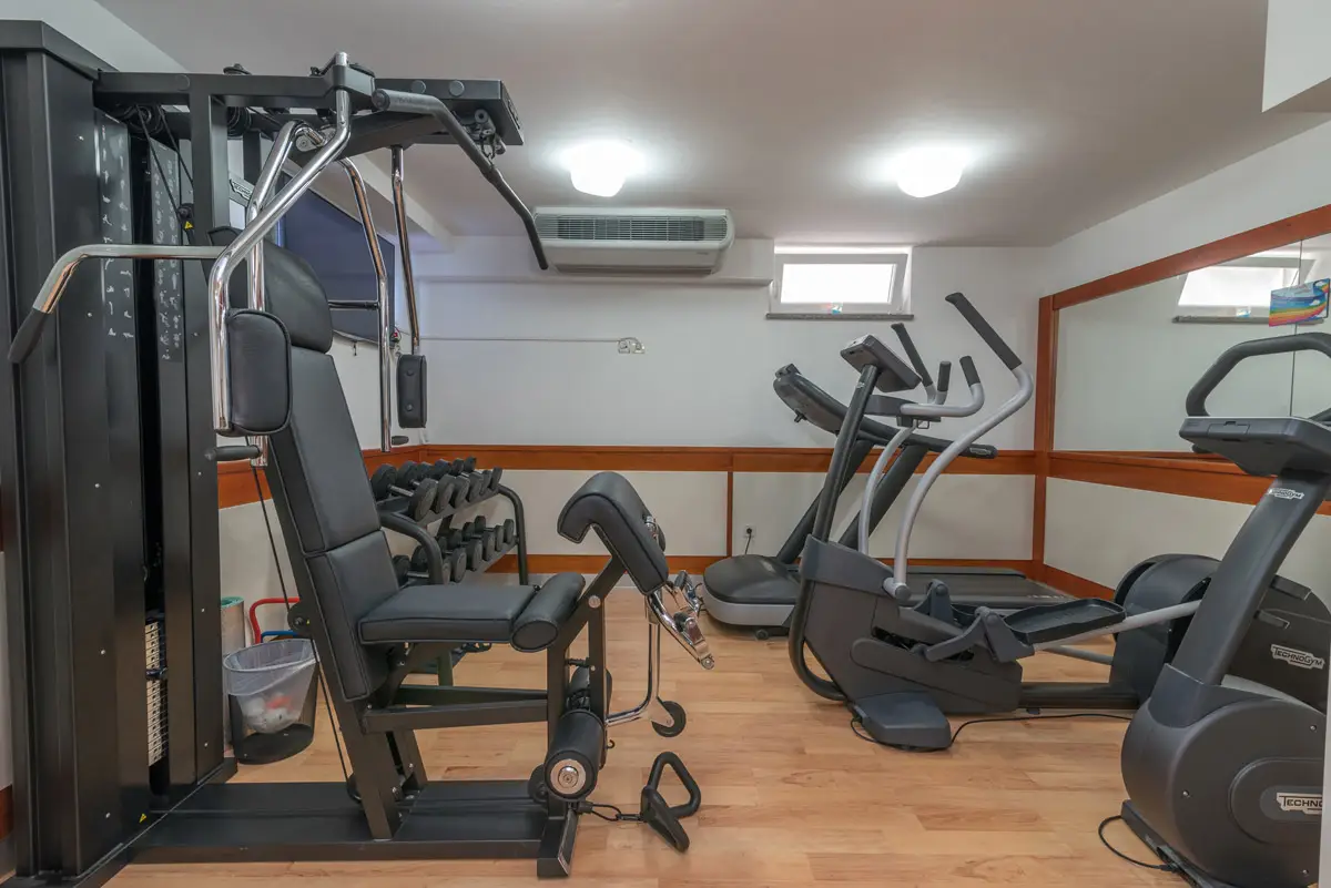 Trogir Palace gym with weight machine and cross trainers