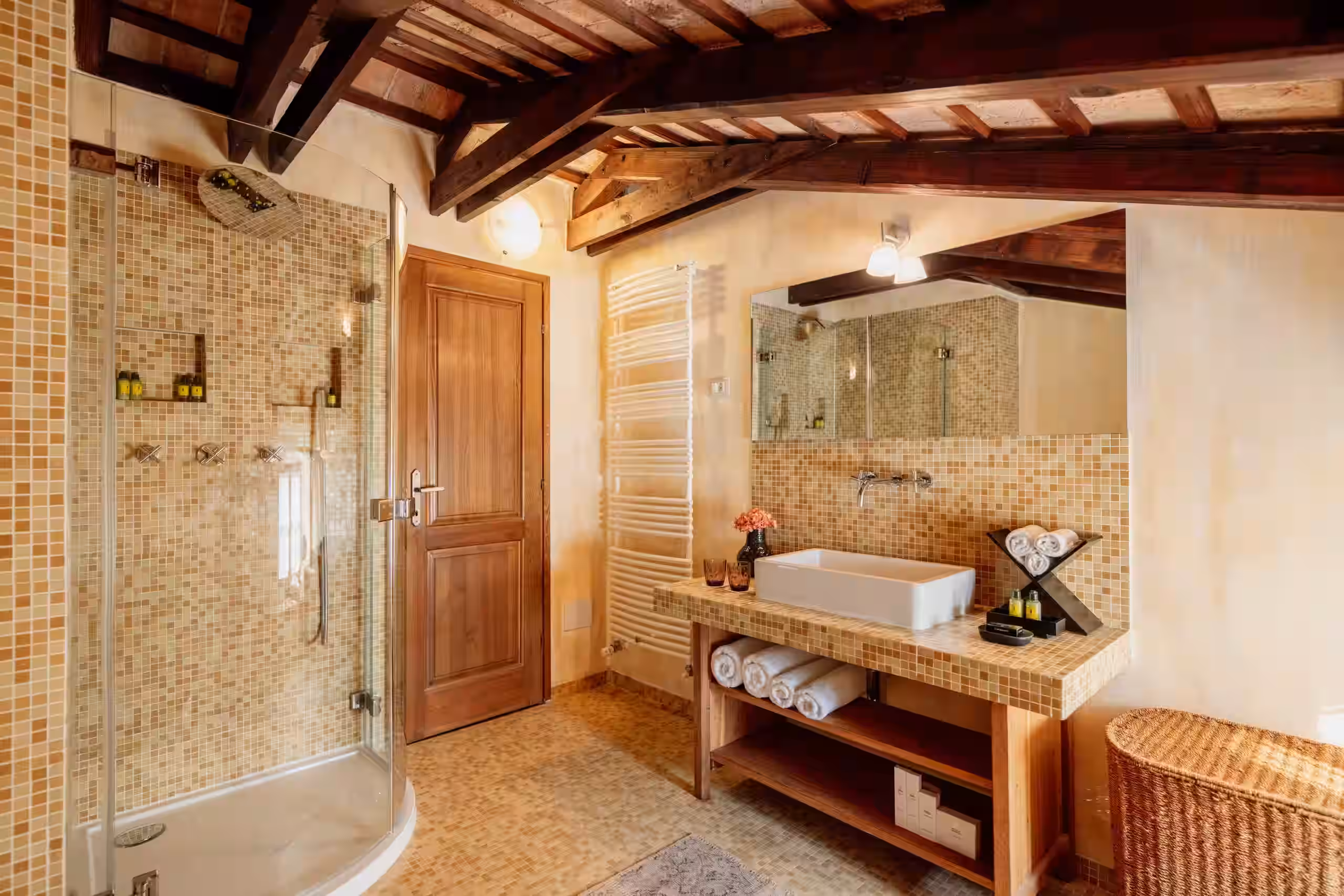 Meneghetti stone bathroom with wooden door and vanity