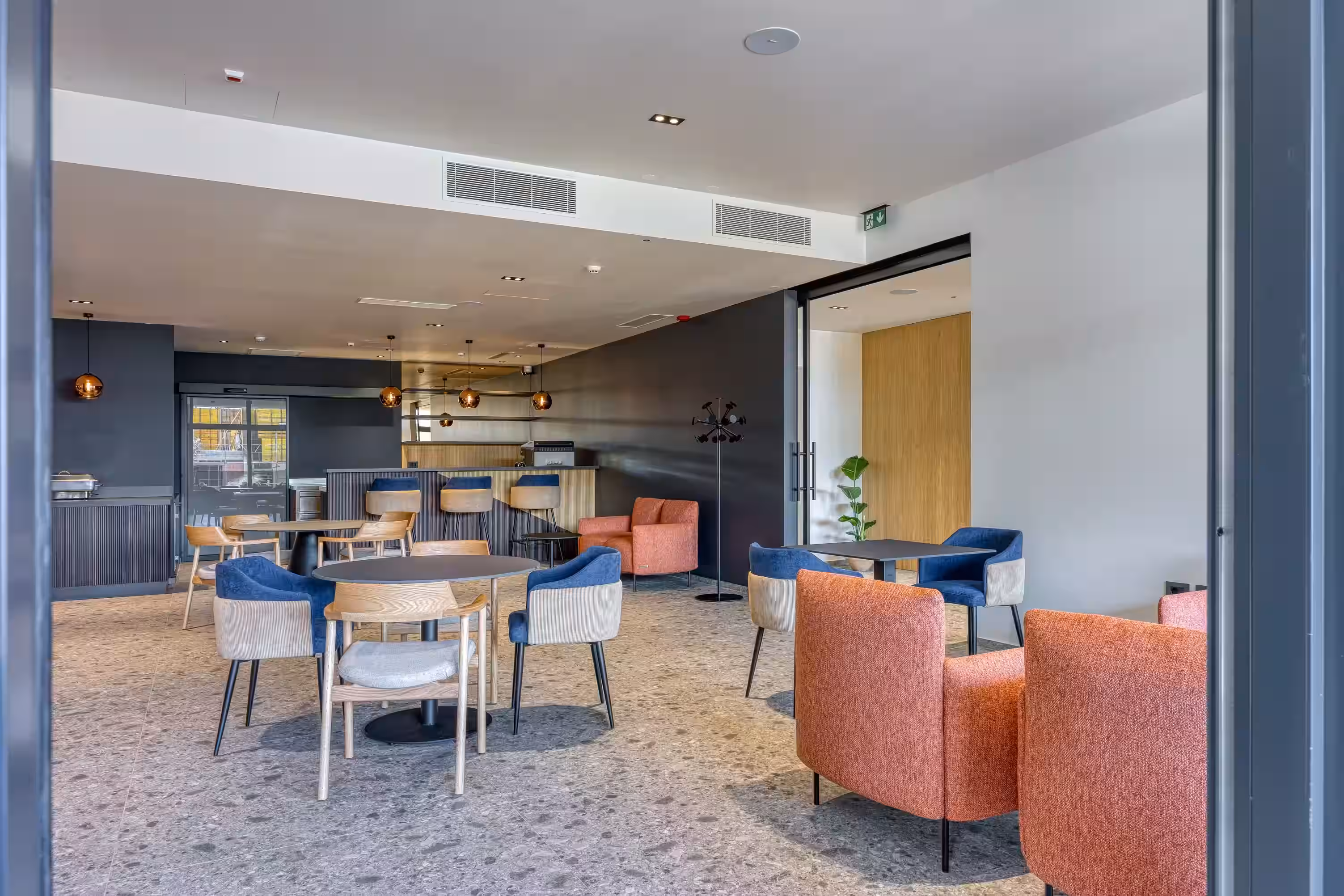 Level 5 Rovinj restaurant with orange armchairs and dining tables