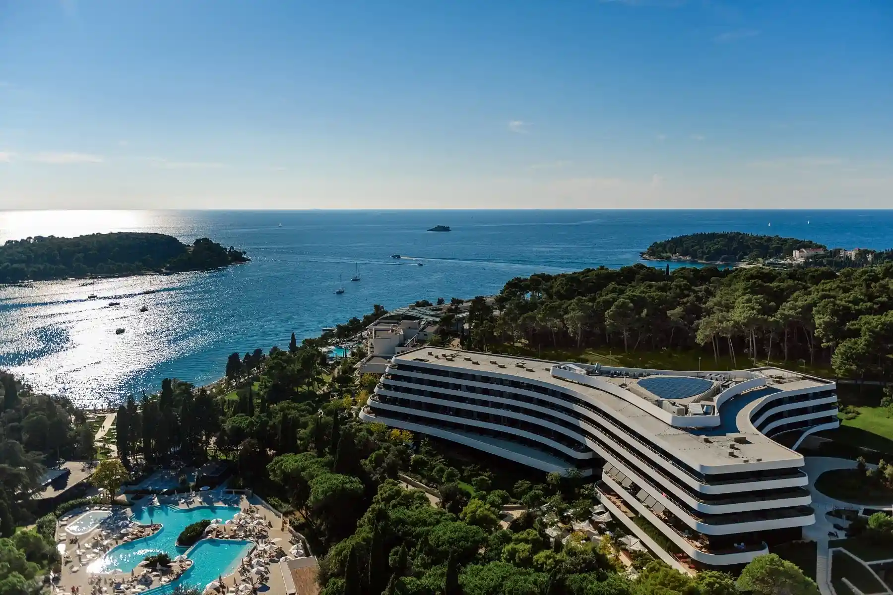 Lone aerial view of the hotel above the sea and islands