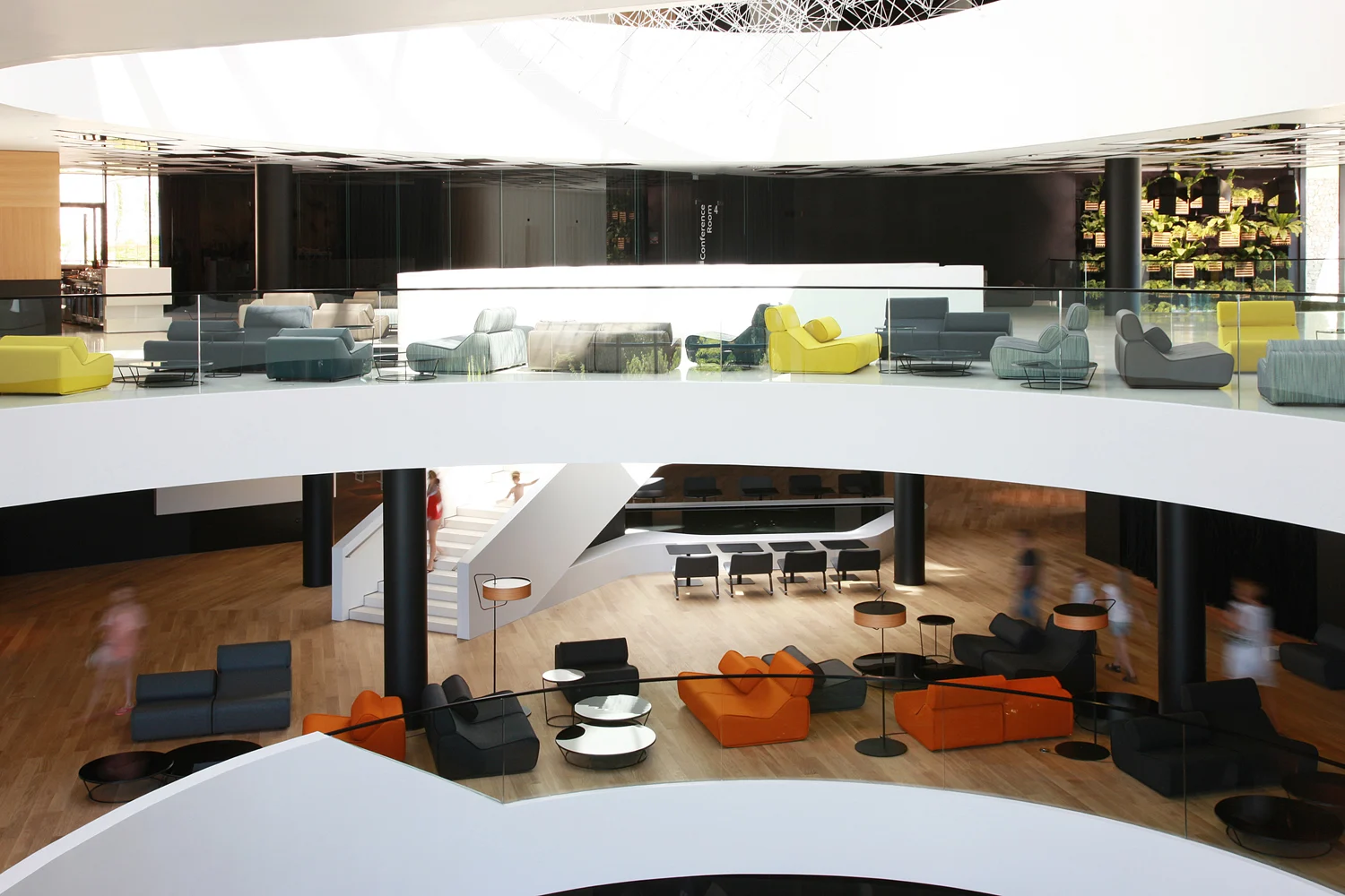 Lone atrium lounge with colourful seating seen from above