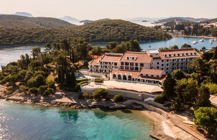 Hotel Liburna aerial view of the hotel on a wooded peninsula by the sea