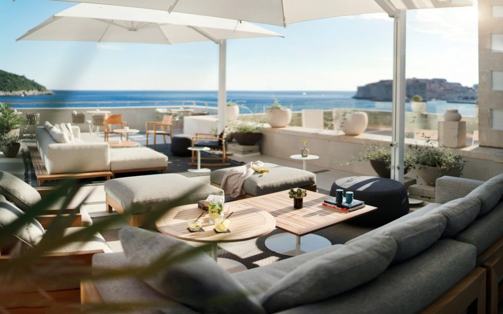 Hotel Excelsior sea-view terrace lounge with sofas and white parasols