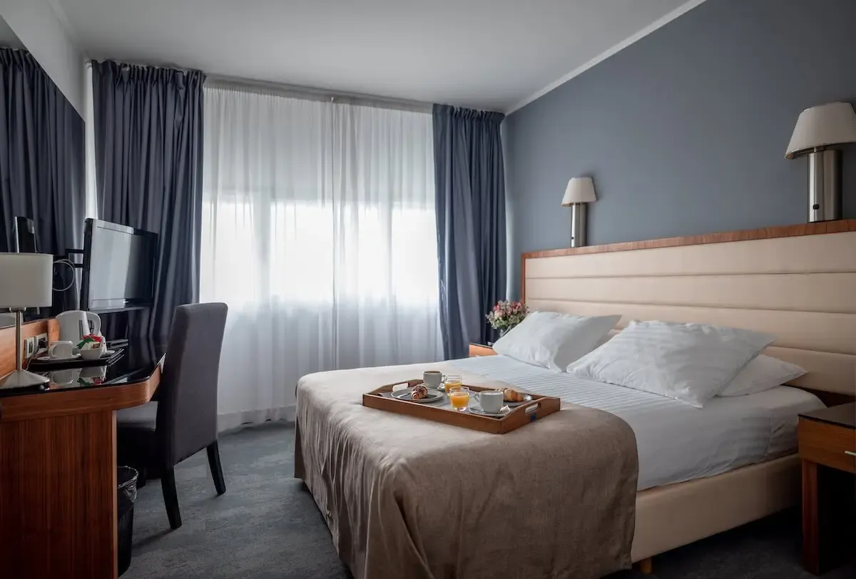 Hotel Lero, Dubrovnik double bedroom with breakfast tray and grey wall