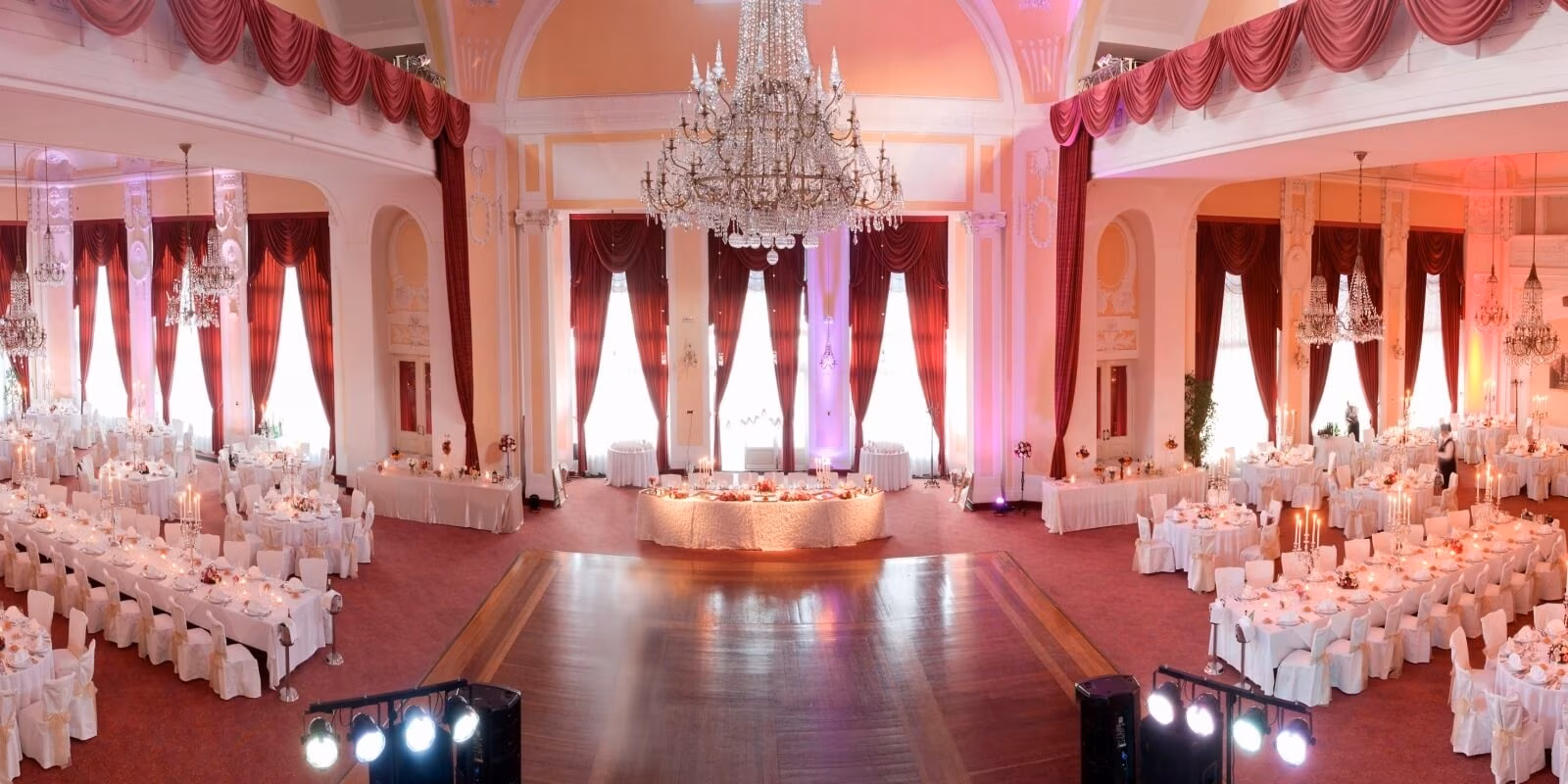 Hotel Kvarner ballroom with crystal chandelier and red drapes