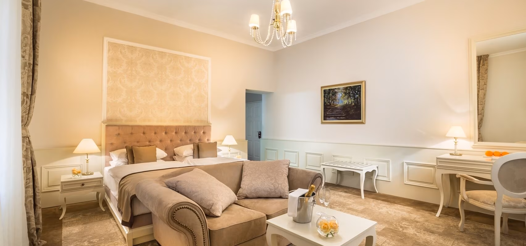 Hotel Kvarner double bedroom with sofa and crystal chandelier