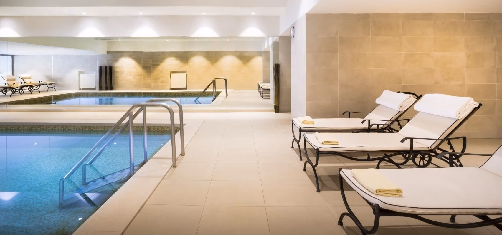 Hotel Kvarner indoor pool with loungers and handrail steps