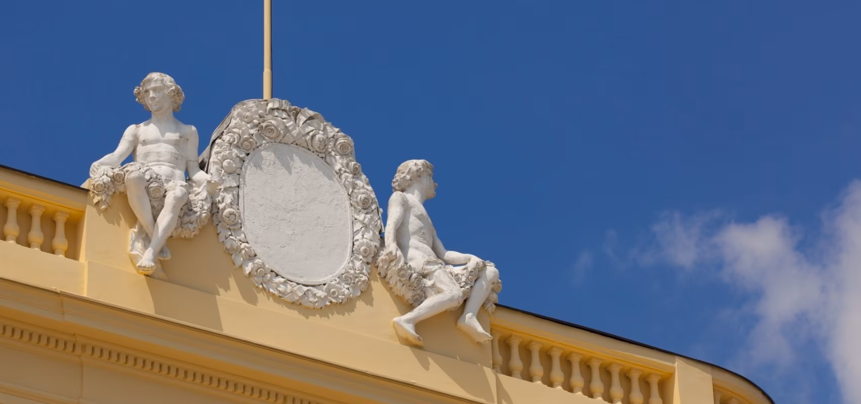 Hotel Kvarner ornate balustrade sculpture against a blue sky