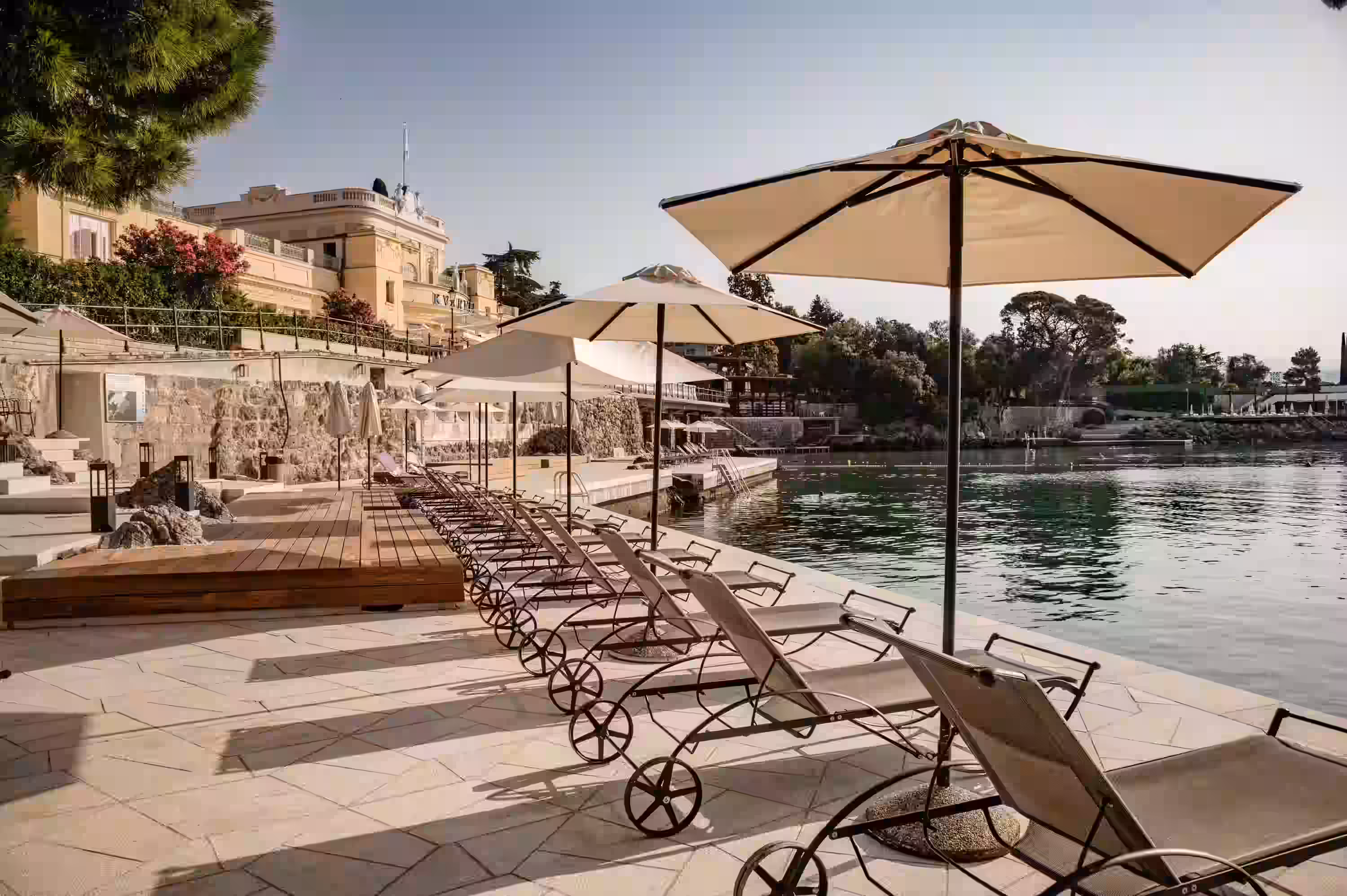 Hotel Kvarner seafront sun deck with loungers and parasols