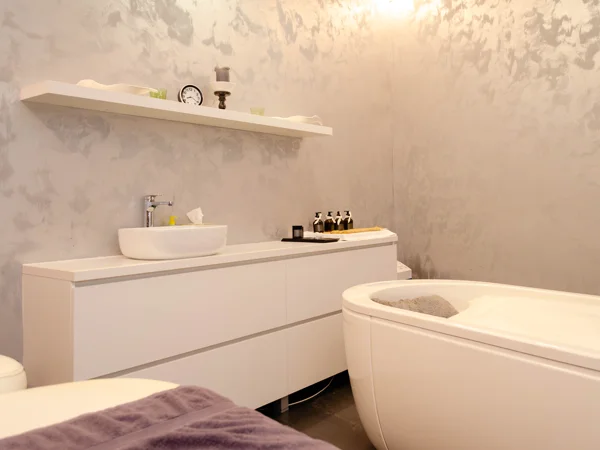 Gospoja white bathroom with freestanding bath and long vanity