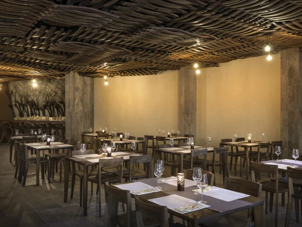 Gospoja restaurant with wooden lattice ceiling and set tables