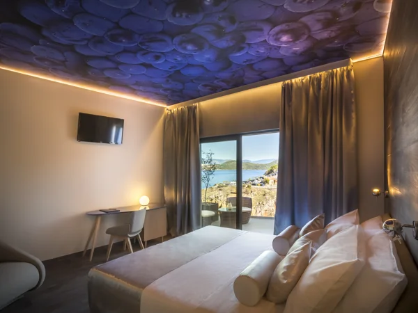 Gospoja bedroom with cosmic ceiling mural and balcony