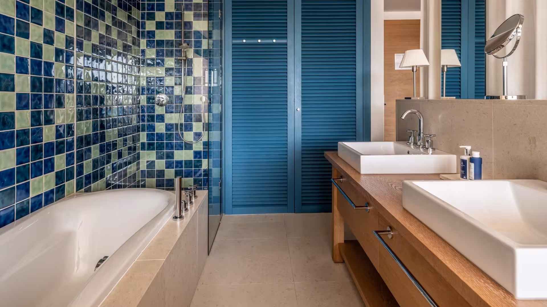 Falkensteiner Hotels Iadera/Senia Apartments bathroom with blue mosaic tiles, bathtub and double basin