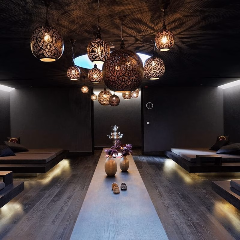 Falkensteiner Hotels Iadera/Senia Apartments dark spa lounge with hanging lanterns and loungers
