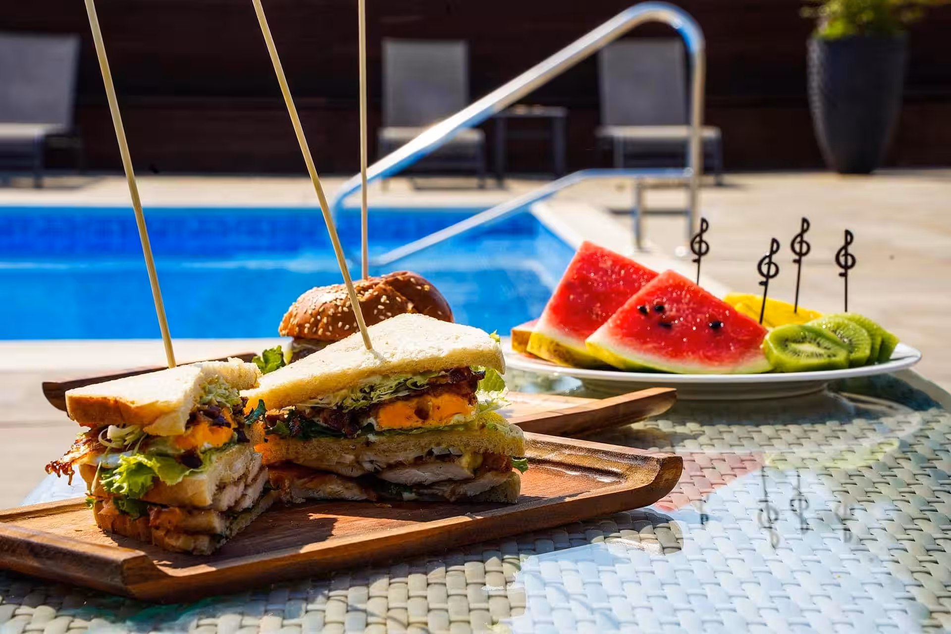 Degenija Hotel club sandwiches and watermelon beside the pool