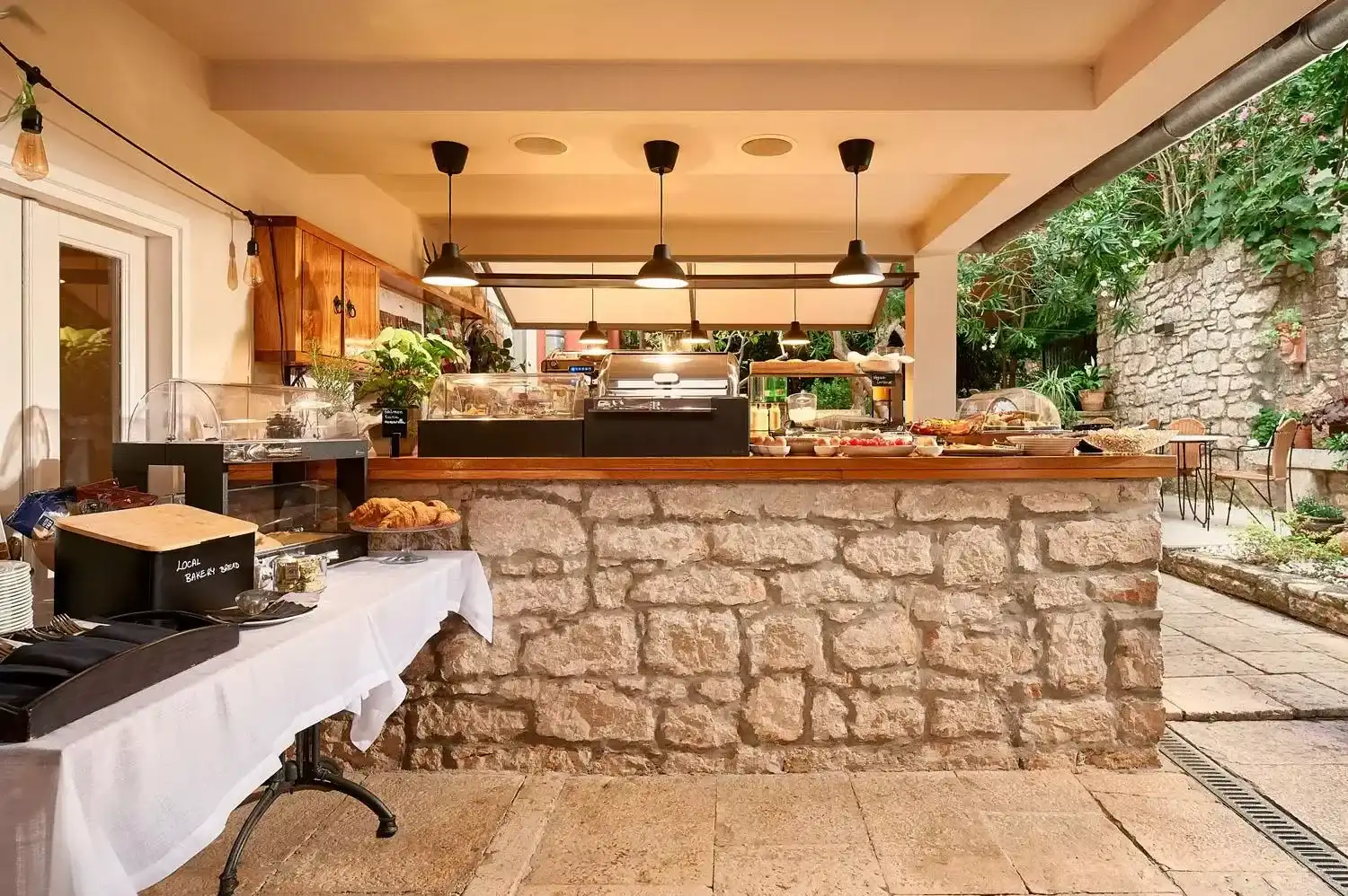 Angelo d'Oro breakfast counter with stone base and buffet display