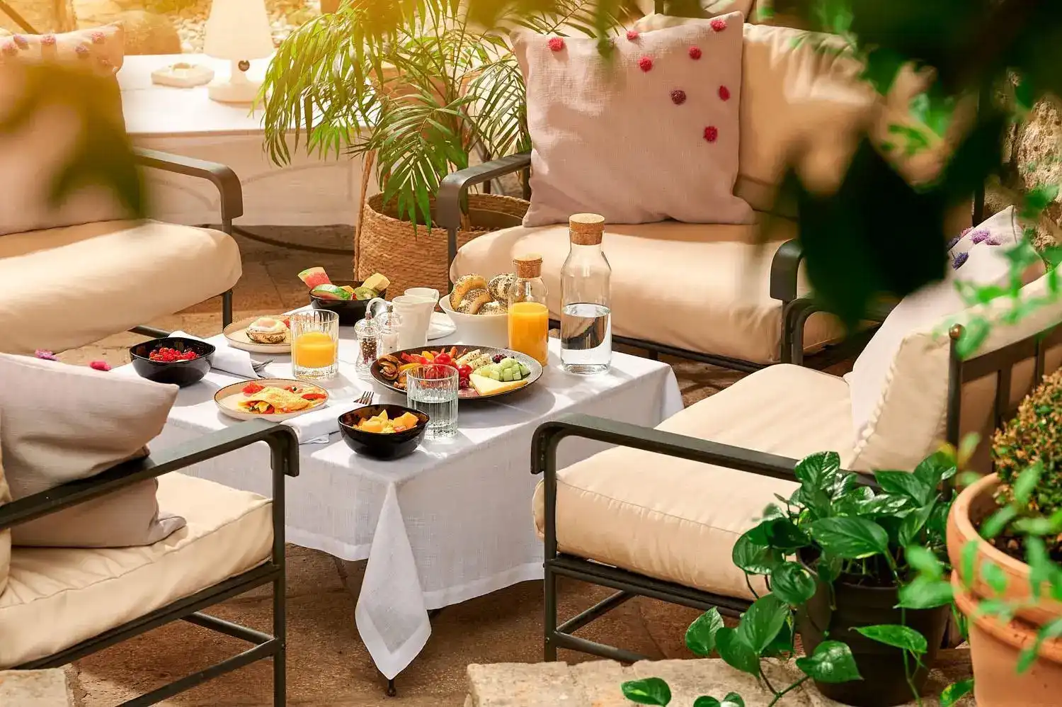 Angelo d'Oro terrace breakfast table with juices and pastries