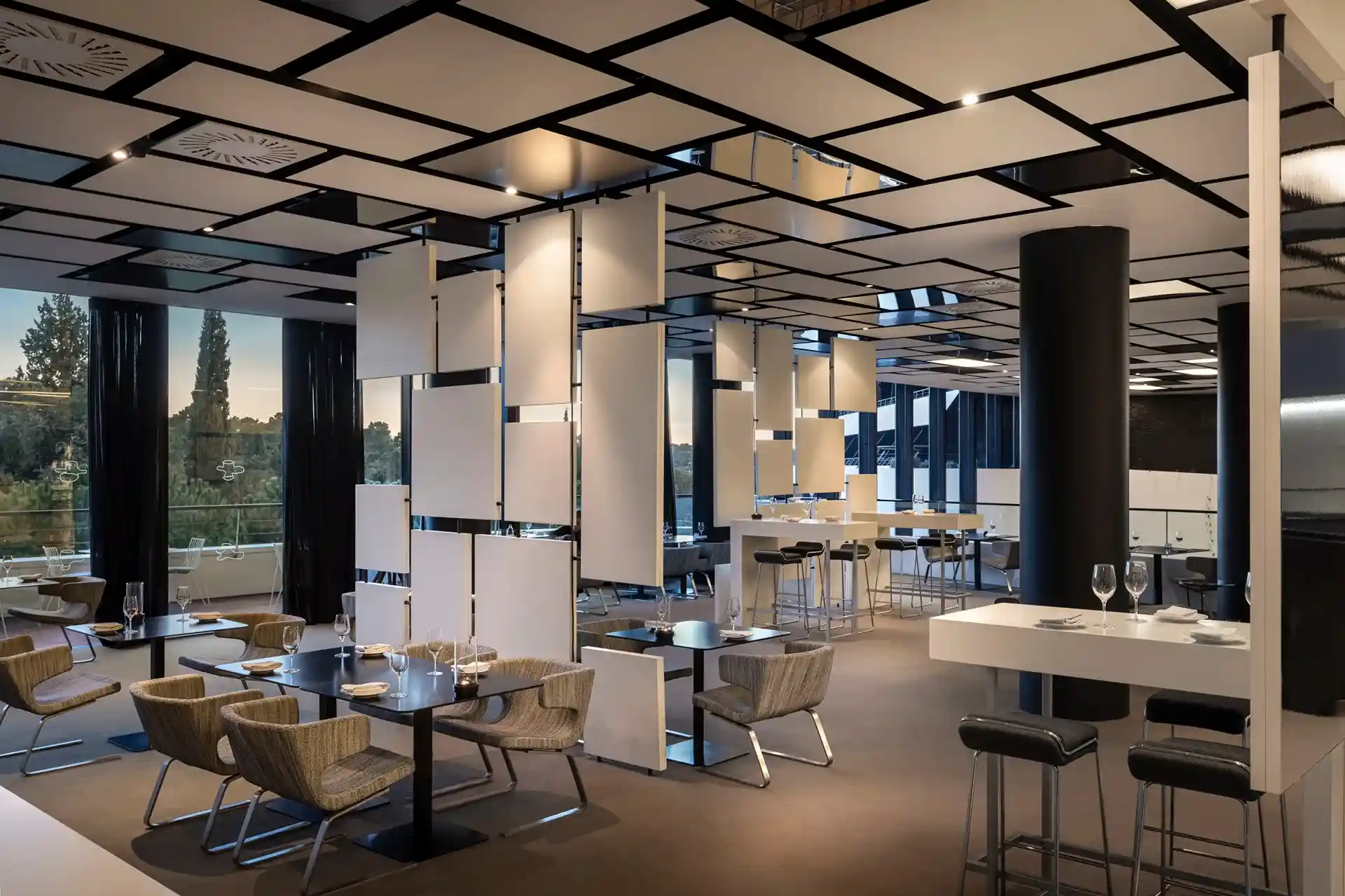Lone lobby bar with geometric ceiling and seating