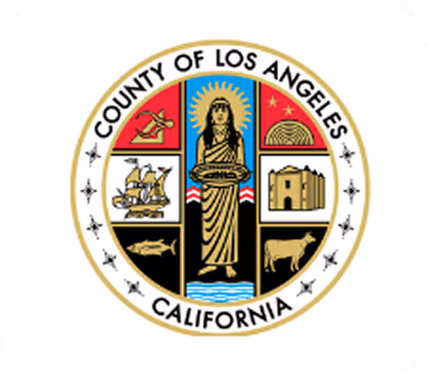 Seal of Los Angeles County, California, featuring a central figure holding grapes surrounded by icons of a ship, a fish, a cow, a mission, and a wheat sheaf.