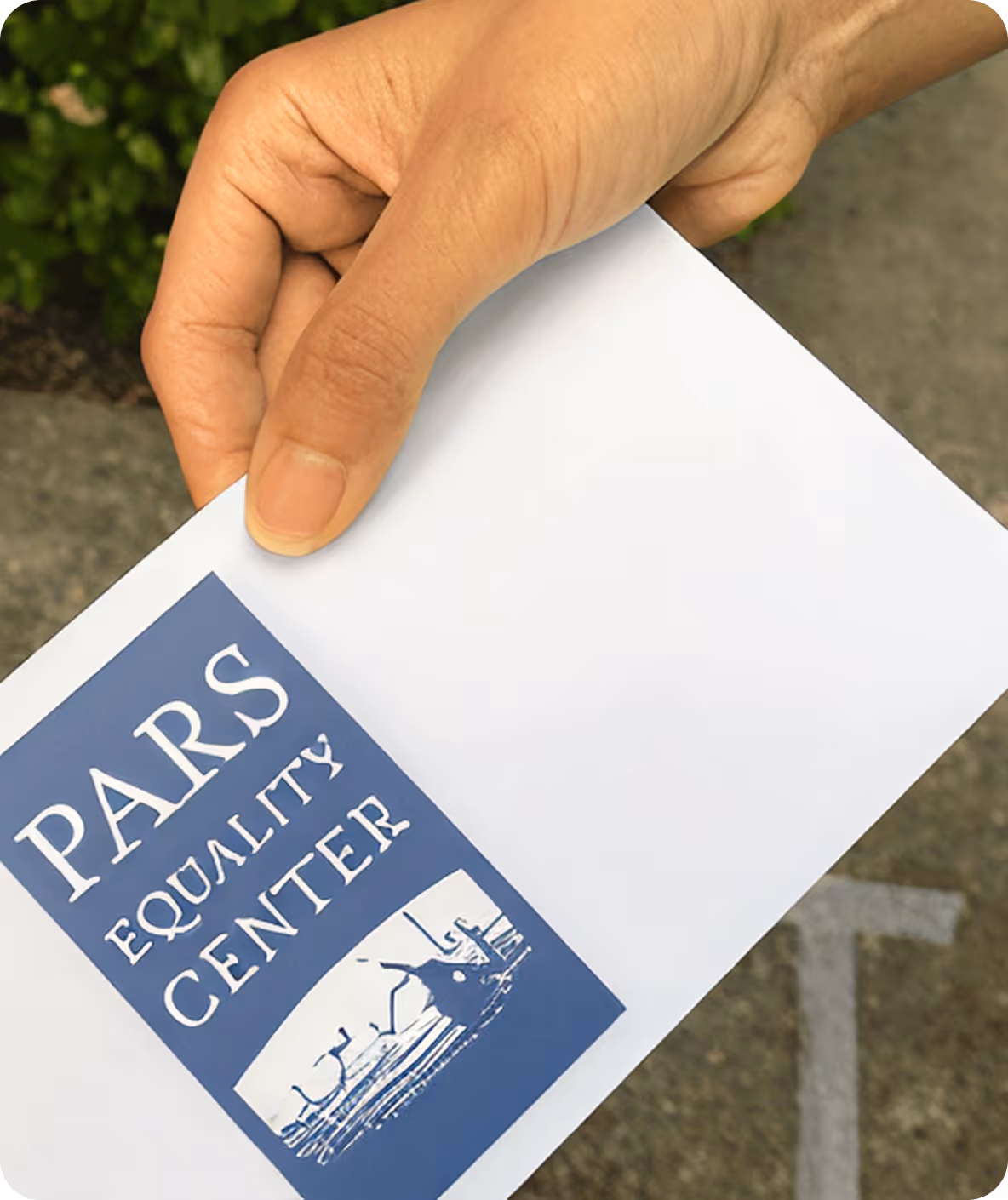 Hand holding a white envelope with a blue label reading 'PARS Equality Center' and an image of birds on wire.