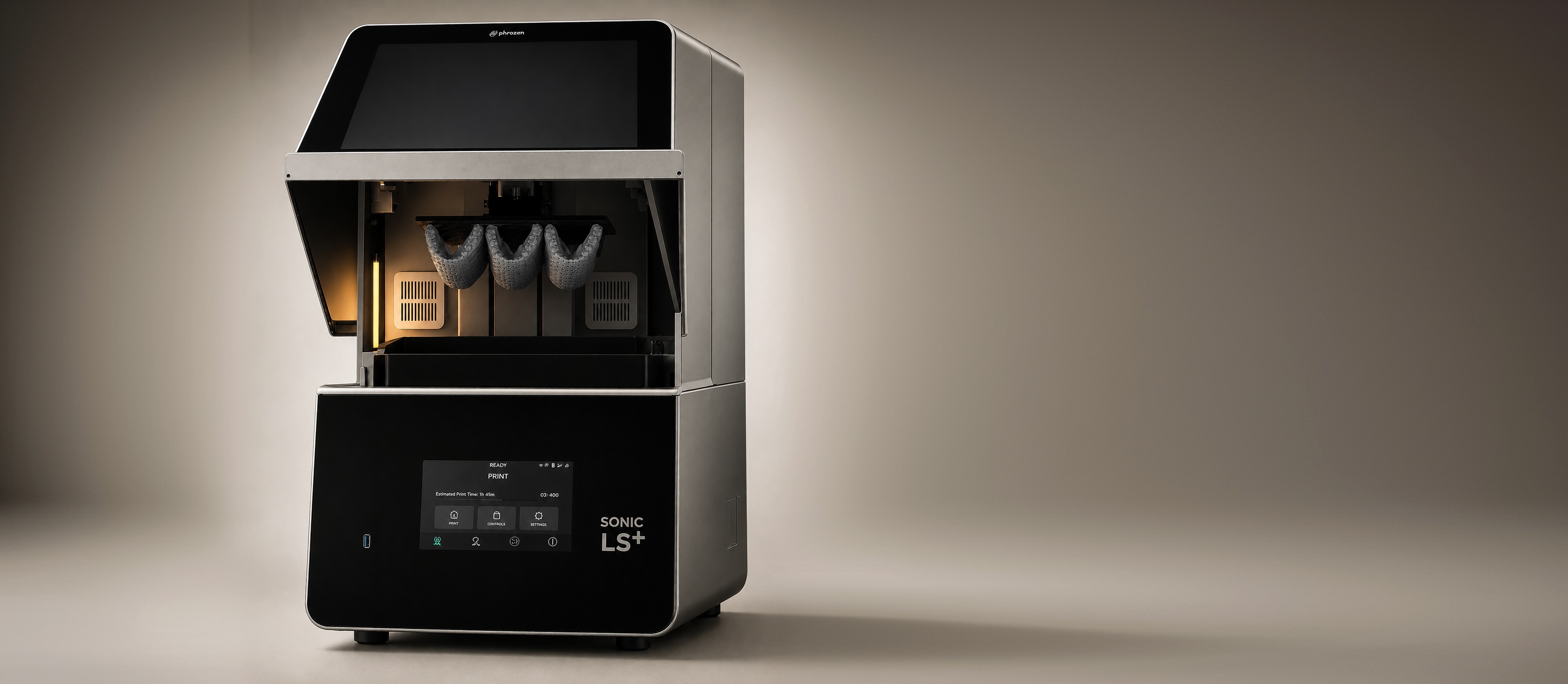 Dento Design Lab DDI Sonic LS+ resin 3D printer with three printed objects inside on neutral background.