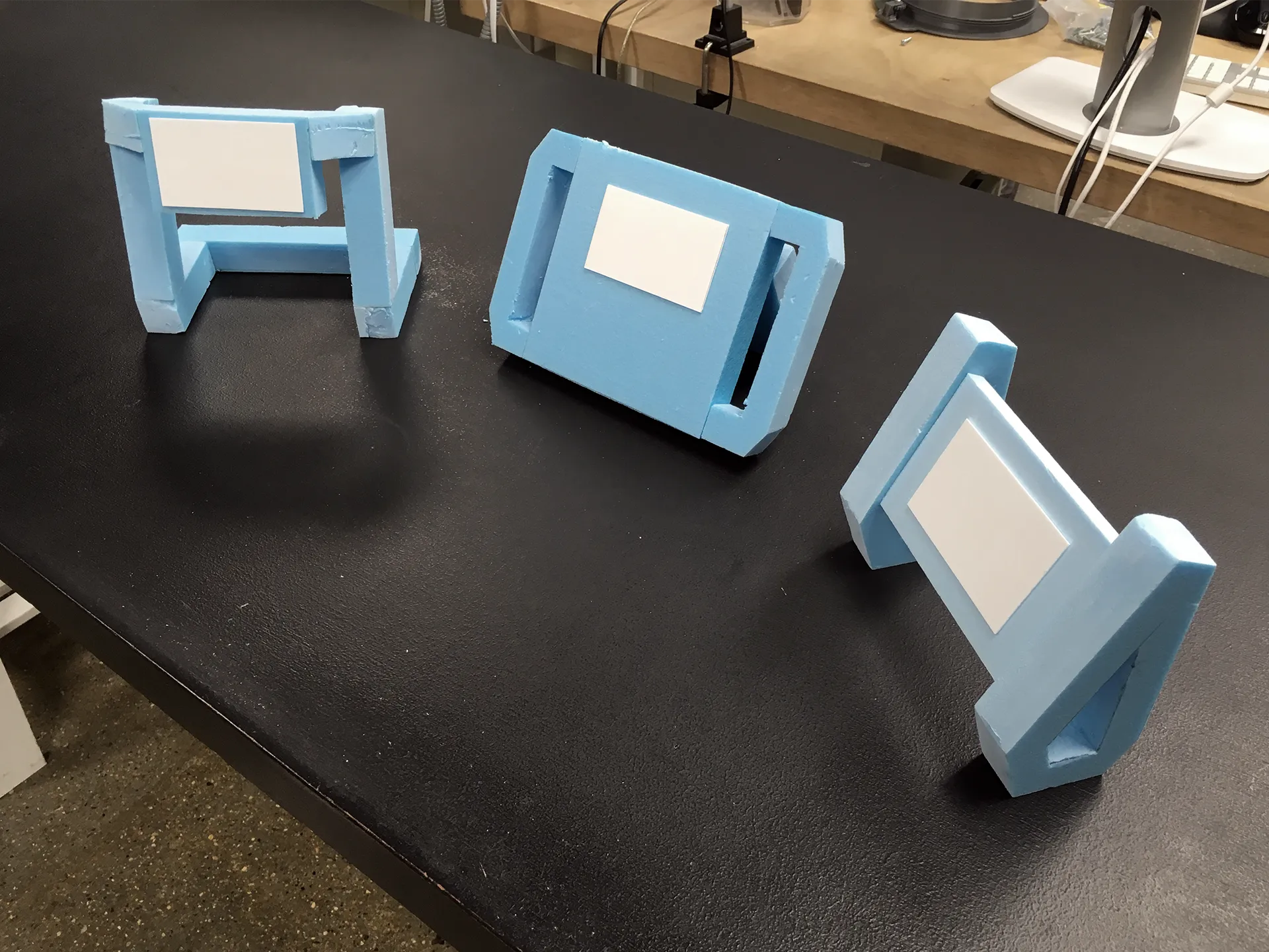 Blue foam models of different handles and screen combinations.