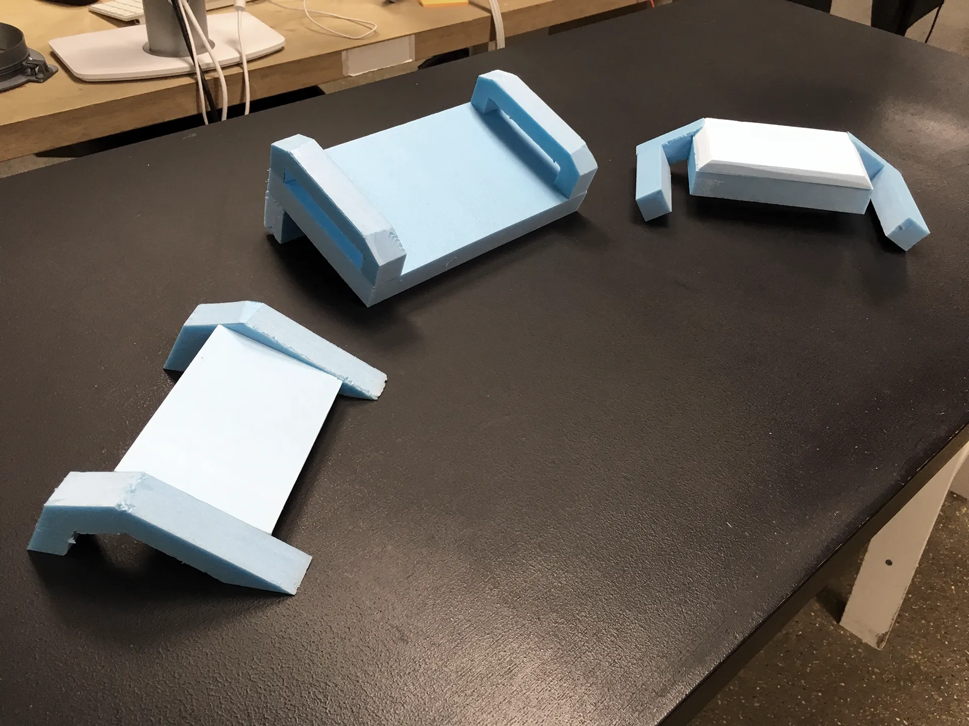 Blue foam models of different handles and screen combinations.