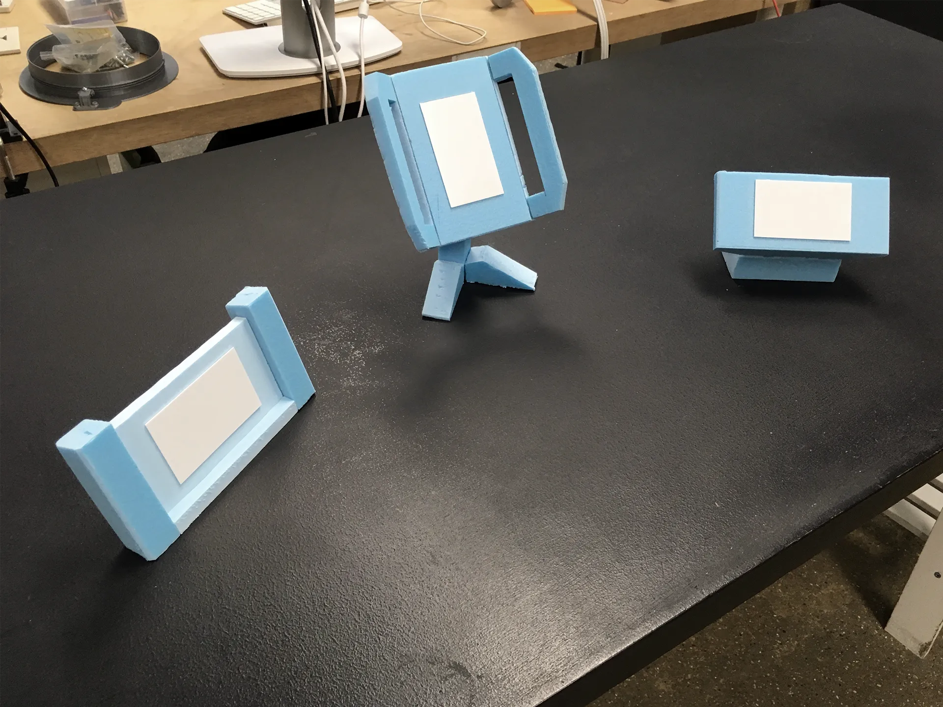 Blue foam models of different handles and screen combinations.