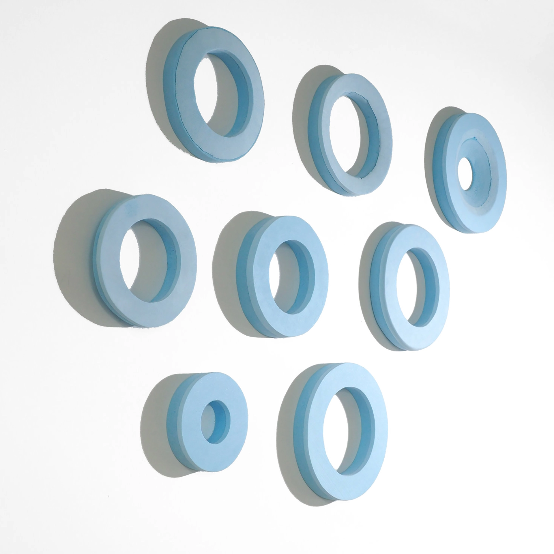 Blue foam models exploring different sizes and shapes.