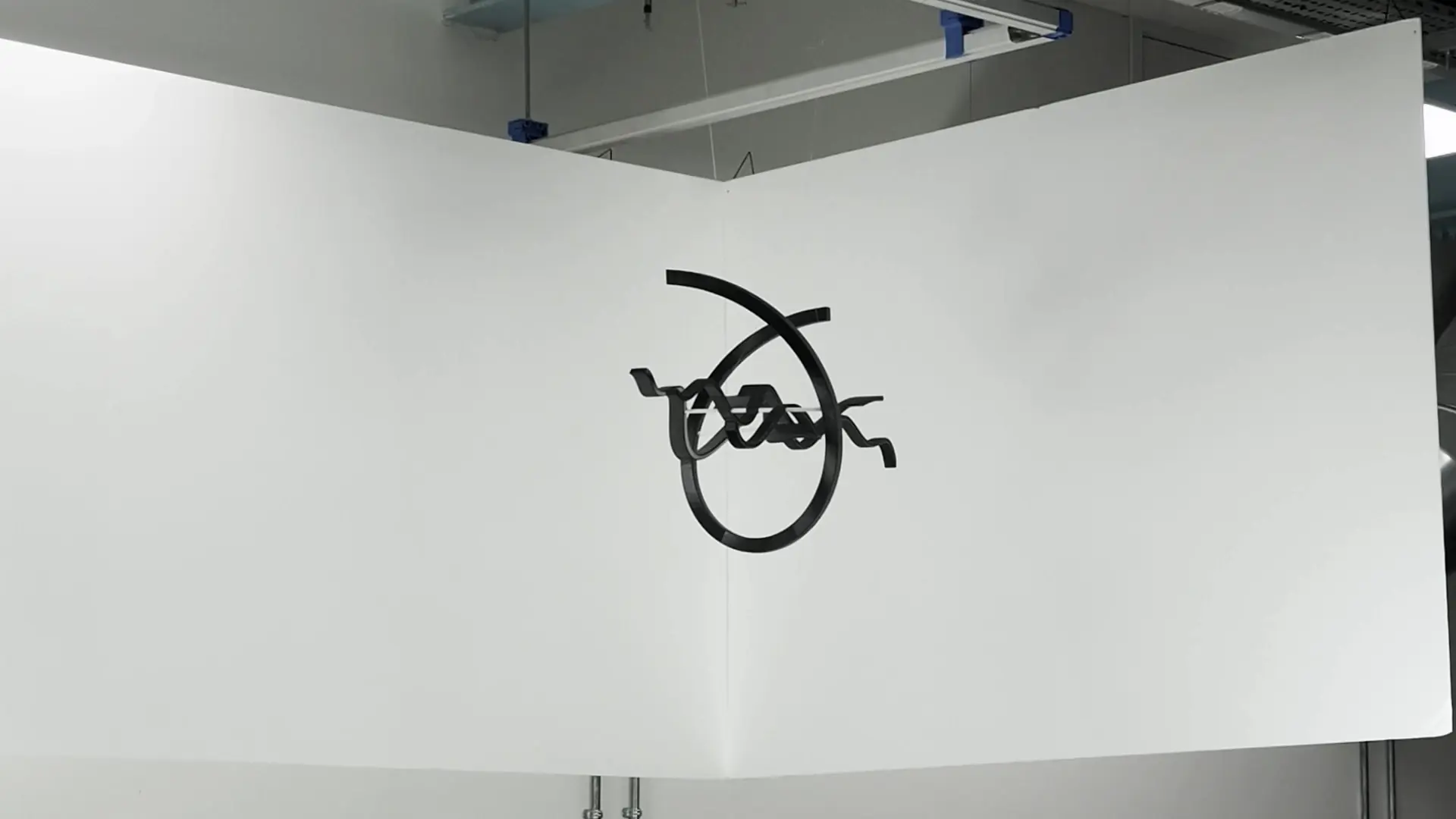 3D printed perspective sculpture of the company logo.