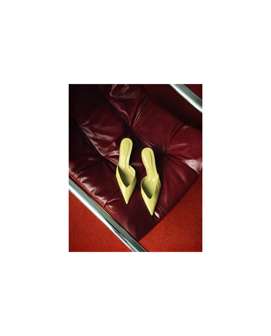 Red high heels on dark red background, Bocav branding — AI product advertising photography by SQUAD, Detroit AI Production House