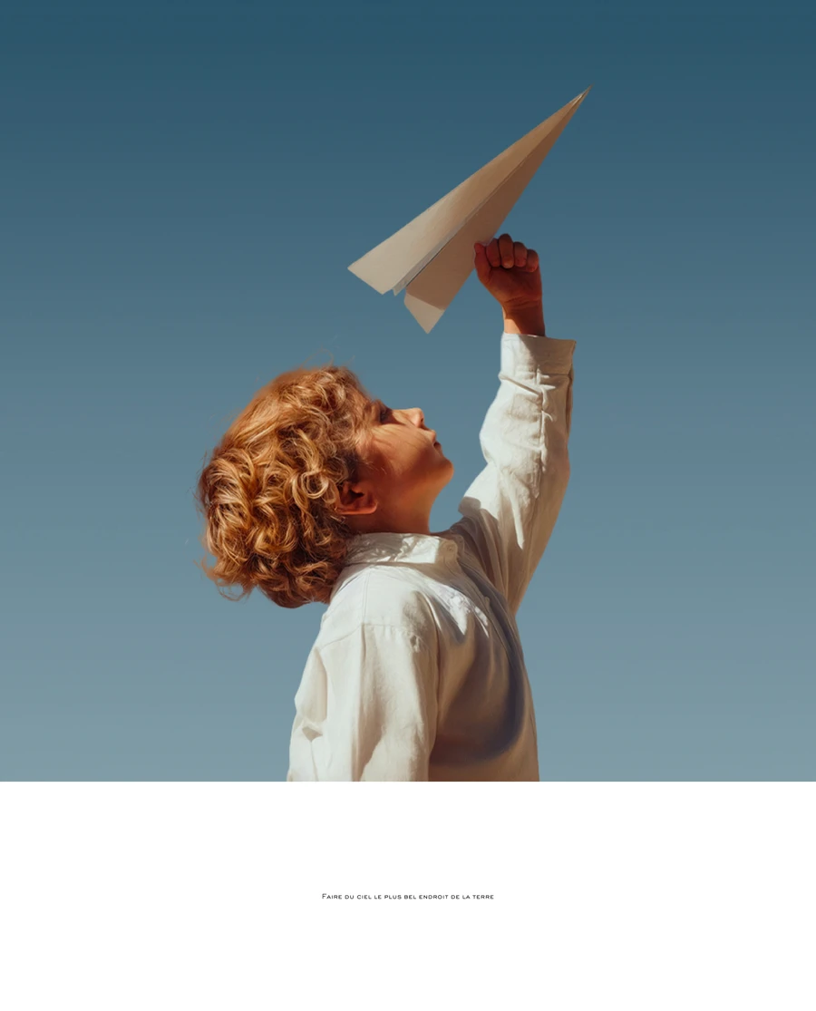 Child throwing a paper airplane against a blue sky — AI advertising photography by SQUAD, Detroit AI Production House