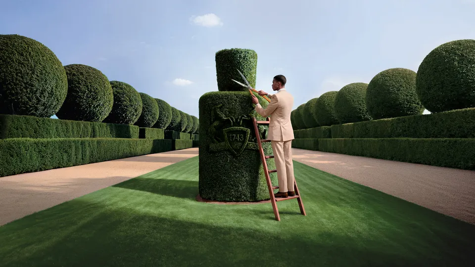 Parfums de Marly Fragrance Finder, gardener trimming a topiary in a formal garden, AI visual by Detroit