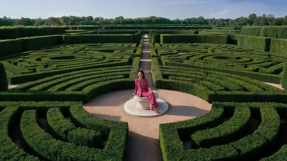 Aerial view of a woman in pink suit seated at the center of a boxwood hedge maze, Parfums de Marly — cgi studio Detroit, photography & DA by Alex
