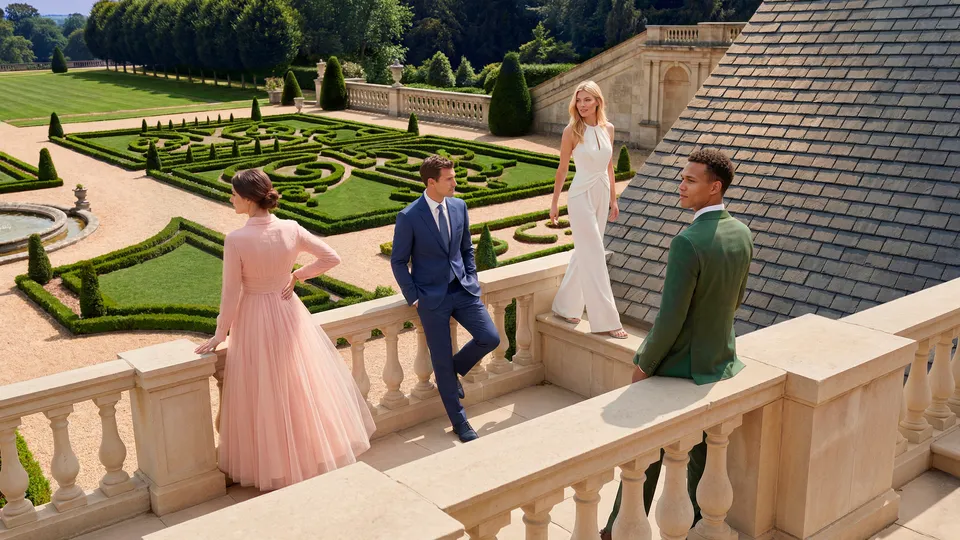 Four Parfums de Marly models on a sunlit balcony above a geometric garden parterre — virtual production studio Detroit, photography & DA by Alex
