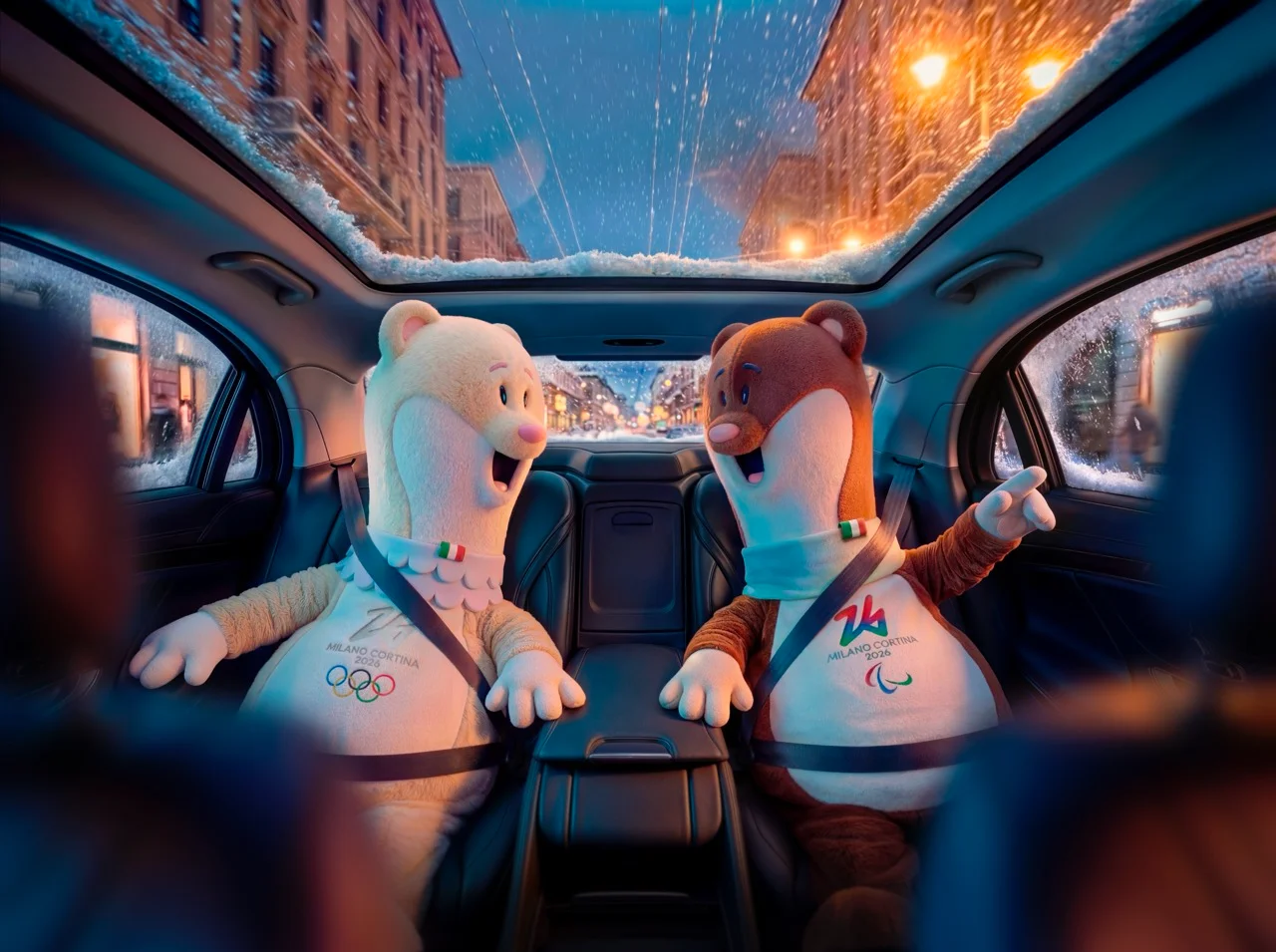 Two plush Milano Cortina 2026 Olympic mascots buckled into an Uber car's back seat on a snowy night street — 3d product animation Detroit, photography & art direction by Detroit AI Production House