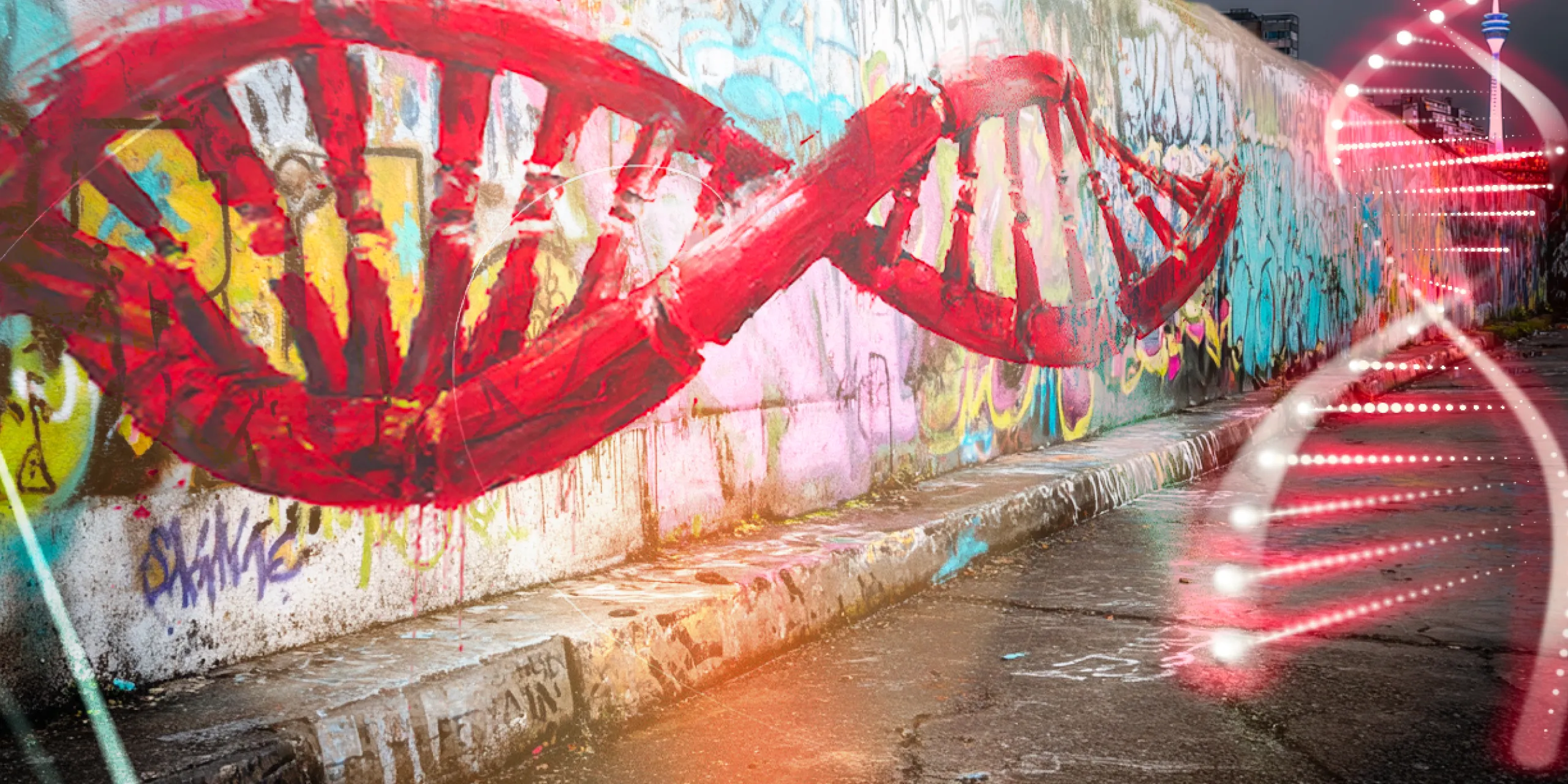 Graffiti-Straßenkunst in Form einer roten DNA-Doppelhelix über einer mit bunten Graffiti bedeckten Mauer in einem urbanen Bereich.