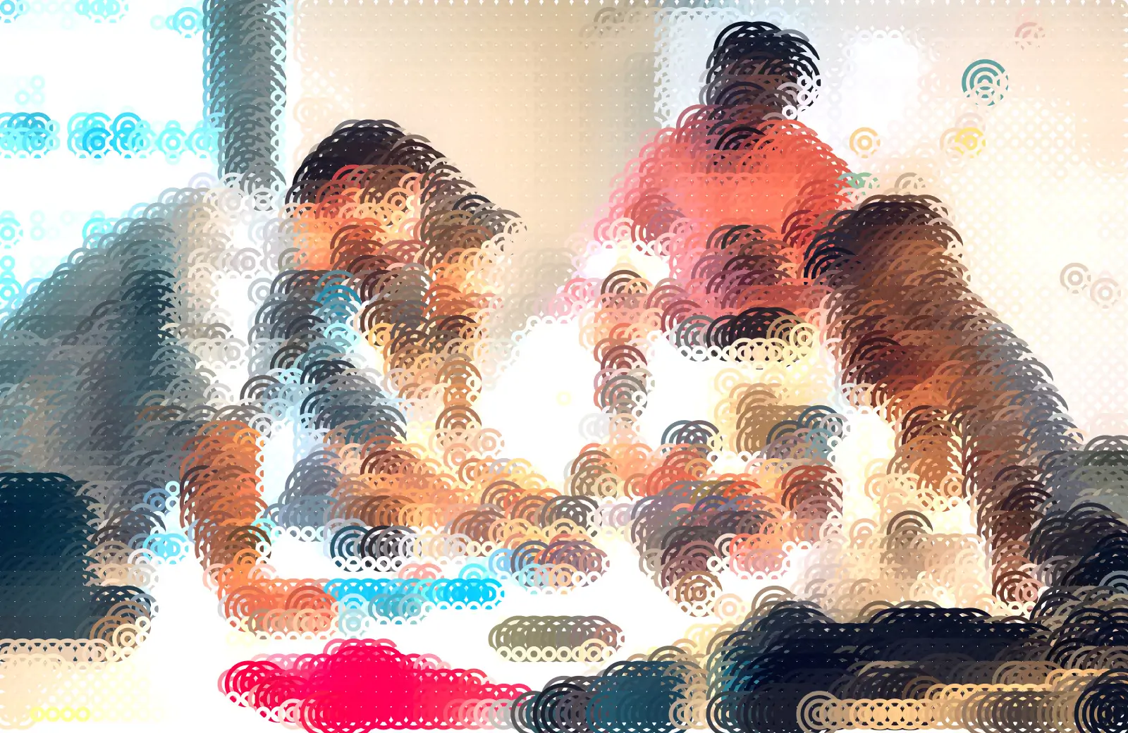 Quatre personnes en réunion de travail autour d'une table avec des documents et un ordinateur portable.